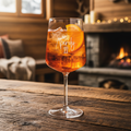Holy Aperoly Glas mit Aperol Spritz im Chalet